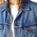Giubbino con bottoni trucker jeans denim medio