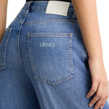 Jeans wide leg con piega stirata denim medio