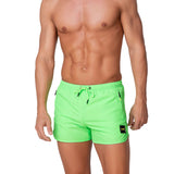 Short mare con zip laterali verde fluo