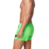 Short mare con zip laterali verde fluo