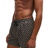 Black allover print swim shorts