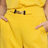 Elegant trousers with yellow chain