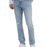 Jeans slim con effetto strappi in denim chiaro