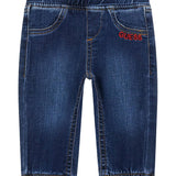 Jeans pull on con orsetto sul retro denim scuro