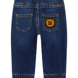 Jeans pull on con orsetto sul retro denim scuro