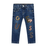 Jeans skinny con logo patch con pailettes