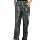 Pantalone stile jogger con paillettes e fascia a contrasto verde