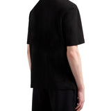T-shirt con tasca sul petto e logo ricamato nero