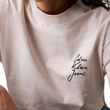 T-shirt maniche lunghe taglio crop logo script panna