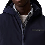 Giubbino con zip e cappuccio in tessuto tecnico blu