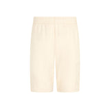 Shorts logo sul fondo a rilievo beige