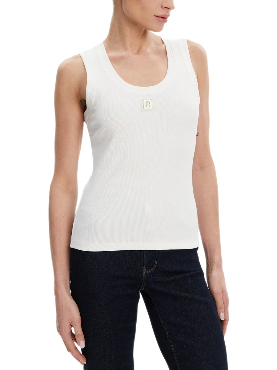 Top a costine con logo patch bianco