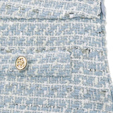 Minigonna in tweed celeste
