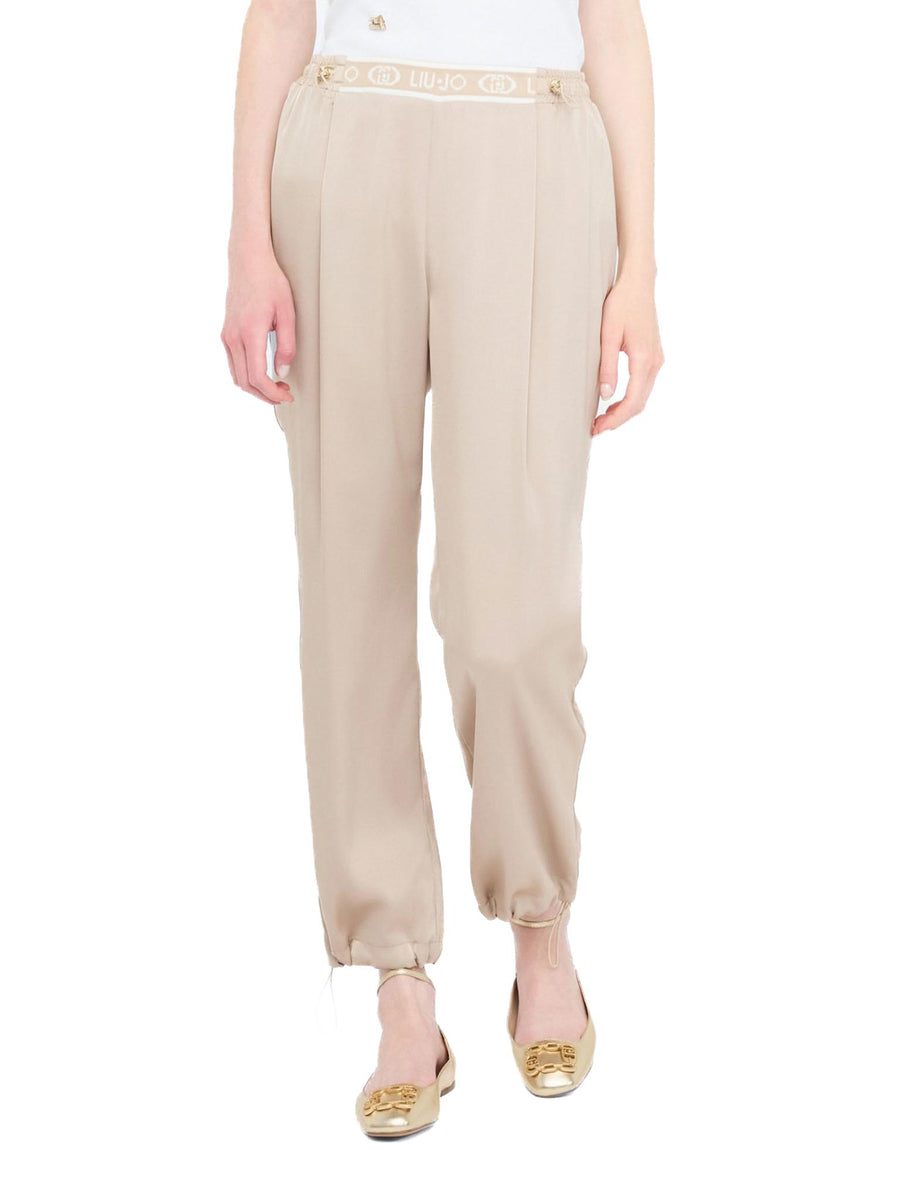 Pantalone in satin con banda logo champagne