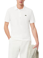 Polo Lacoste uomo con maniche corte modello light piquet bianco