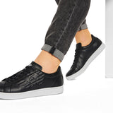 Black embossed logo sneakers